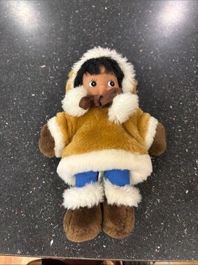 Precious Indigenous doll in coat and boots